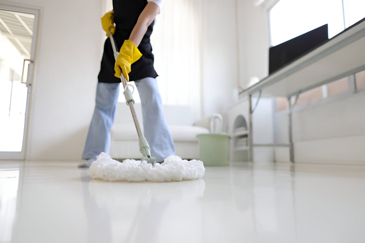Move Out Cleaning 1 Professional house cleaning service with mop and bucket.